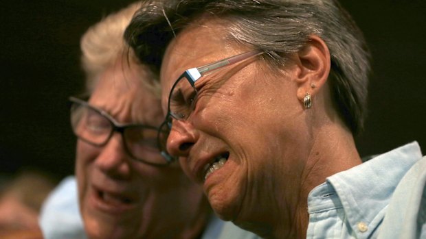 Judy Rettig, right, and Karen Castelloes cry during a prayer vigil in Orlando after the massacre at the Pulse Orlando nightclub.