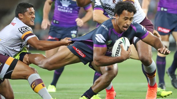 Storm front: Melbourne's Felise Kaufusi tries to evade a Broncos tackle at AAMI Park in round three.