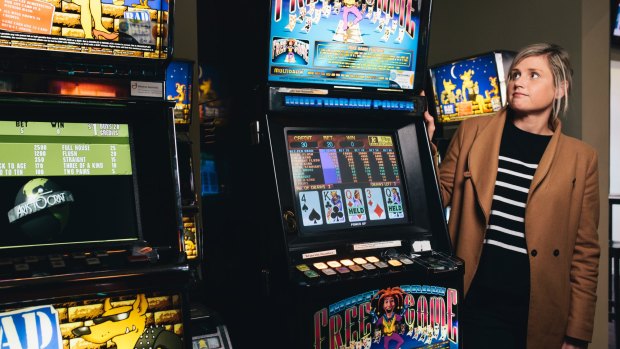 Australian Hotels Association ACT's Jo Broad with aging poker machines at the Statesman Hotel in Curtin.