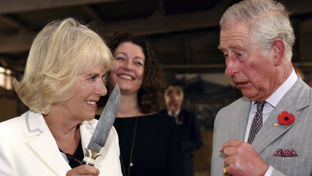 Britain's Prince Charles jokes with his wife Camilla, Duchess of Cornwall during a visit to Seppeltsfield Winery in the Barossa Valley.