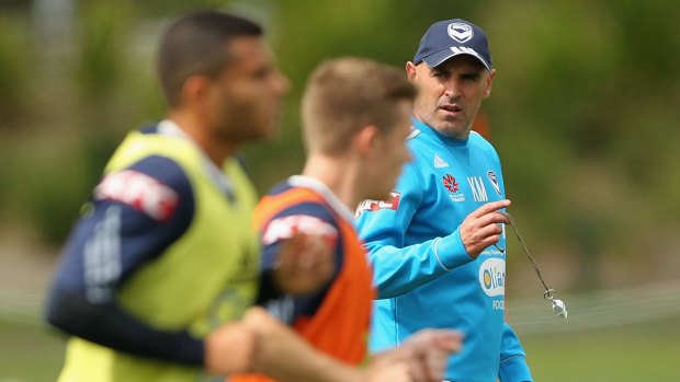 Legend: Coach Kevin Muscat supervises a Melbourne Victory training session. 