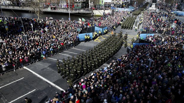 Irish military parade crosses O'Connell Bridge in central Dublin to commemorate the 1916 Easter Rising. 