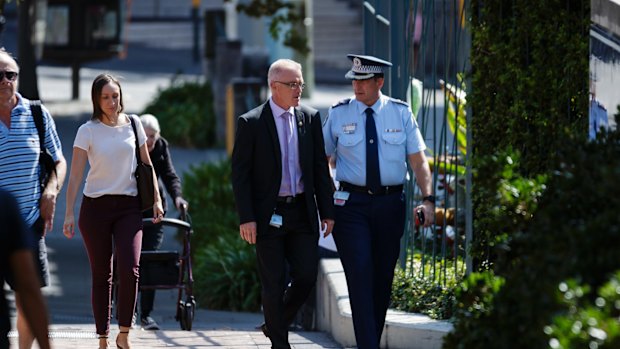 Detectives arrive at St Vincents hospital where Detective John Breda is in a serious but stable condition.