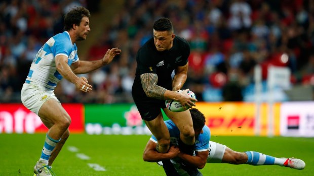 Sonny Bill Williams of the New Zealand All Blacks looks to pass as Ramiro Herrera of Argentina looms during their World Cup pool match at Wembley Stadium in London.