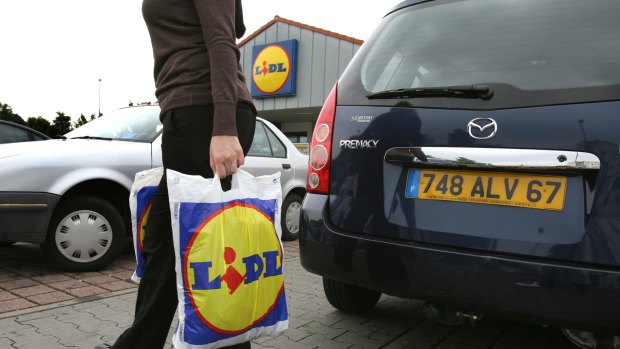 A customer outside a Lidl shop in Germany.
