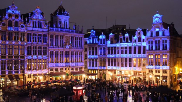 Buildings on the Grand Place in Brussels pulsate with lights in the red, blue and white of the Union Jack during a British-themed evening titled "Brussels Calling" after the European Parliament ratified the Brexit agreement on Thursday.
