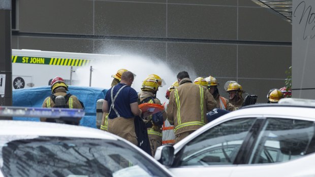 Emergency services outside the inner-city hotel in Auckland on Tuesday.