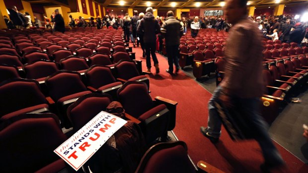 Supporters of Republican presidential candidate Donald Trump depart the Milwaukee Theatre ahead of his defeat in Wisconsin.