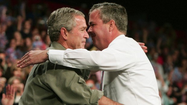 George W. Bush (L) hugs Jeb Bush back in 2006. This week, Jeb said he relied on his older brother for advice on Israel matters.