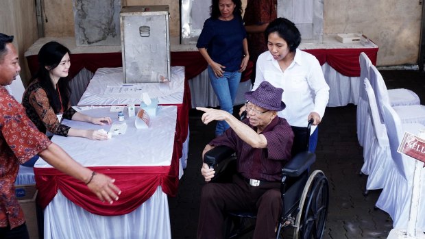 A Jakartan man on his way out of the polling booth.