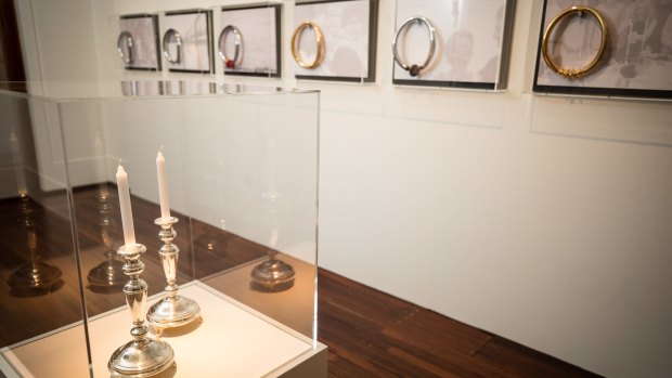 A pair of Shabbat candlesticks and a series of necklaces feature in work by Lousje Skala as part of The Gift, an exhibition about migration at the Museum of Australian Democracy at Old Parliament House in Canberra.