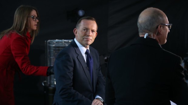 Prime Minister Tony Abbott sells the budget outside Parliament House in Canberra.