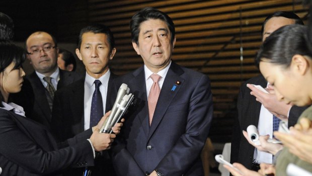 Shinzo Abe speaks to reporters at his official residence on Wednesday after a five-day Middle East trip.