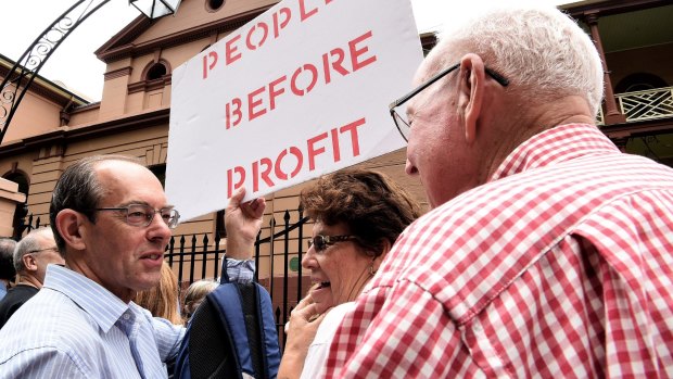 Protesters in front of NSW Parliament House demonstrating against the NSW government's privatisation of the Land Titles Registry.