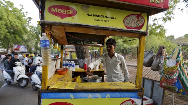 A vendor works at a roadside Maggi noodles eatery in Ahmedabad, India.