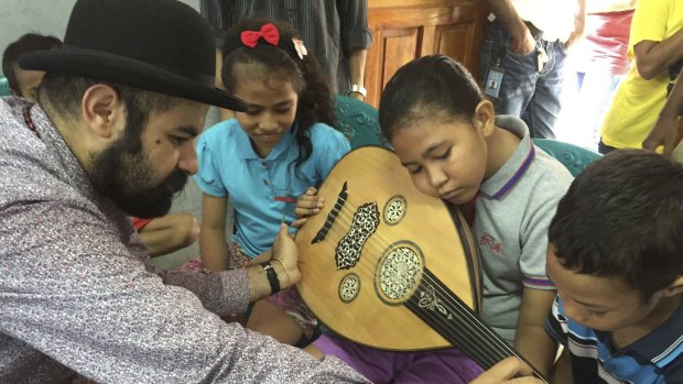 Joseph Tawadros introduced East Timorese school children to the oud during a visit in March.

