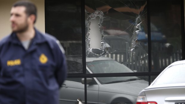 A window that was damaged during the terror raid in Hallam.