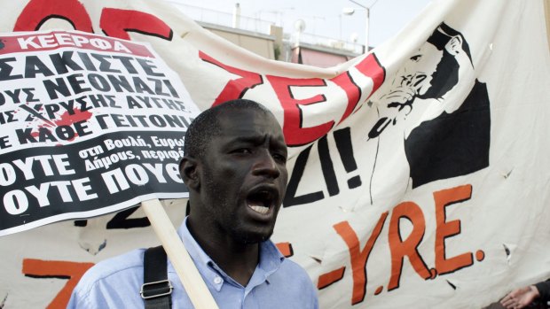 Members of anti-racist organisations and migrants protest outside the high-security prisons near Athens during the trial of the ultra nationalist Golden Dawn party.