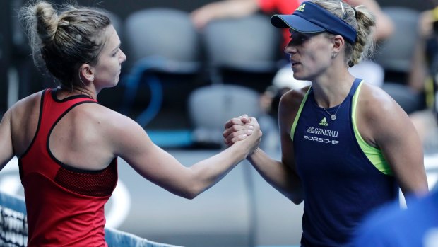 Simona Halep (L) of Romania and Angelique Kerber (R) of Germany greet each other after their Australian Open semifinal match.