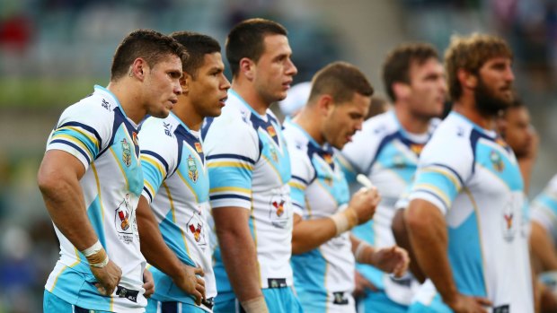 Disappointment: Titans players look dejected after conceding a try last season.