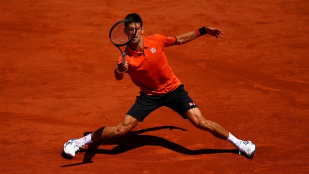 Novak Djokovic of Serbia assumes an awkward pose as he effects a return during his semi-final against Andy Murray. 