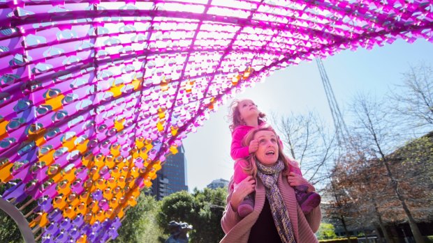 The Age, News . The NGV release its new Garden Sculpture, a nine metre high pink pavilion.The first visitors Lexi and mum Julie Wise in the foreground.Pic Simon schluter 23 September 2015.