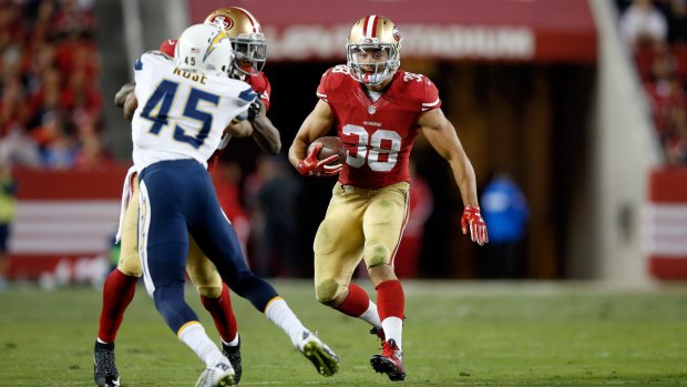 Made the cut:  Jarryd Hayne runs the ball against the San Diego Chargers.