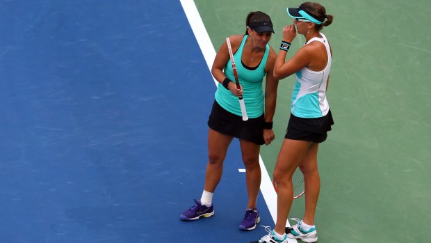 Casey Dellacqua and Yaroslava Shvedova of Kazakhstan during their US Open Women's Doubles Final against Martina Hingis and Sania Mirza 