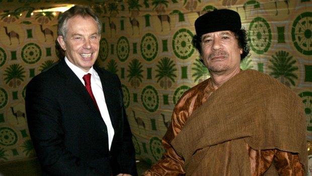 Former British prime minister Tony Blair, left, meets then Libyan leader Muammar Gaddafi, at his desert base near Tripoli in 2007. 