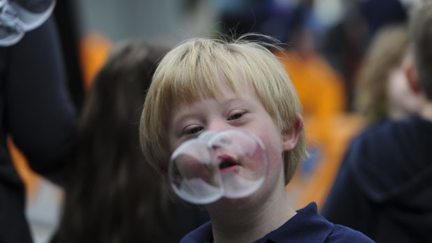 Jack Blackmore, 8, is intrigued by the bubble blowing activity.