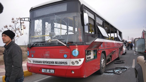 A bus is damaged by a roadside bomb in Diyarbakir on January 16. The bomb killed  three policemen and wounded two others, according to the state-run news agency.  