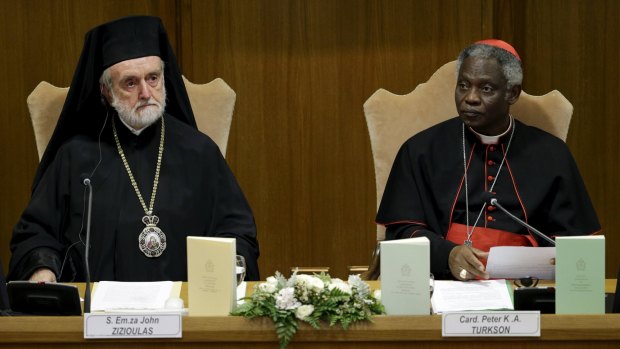 Cardinal Peter Turkson (right) and Eastern Orthodox metropolitan of Pergamon John Zizioulas attend a news conference for the presentation of Pope Francis' new encyclical titled 'Laudato Si (Be Praised), On the Care of Our Common Home', at the Vatican. 
