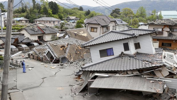 Damaged houses sit after an earthquake in Mashiki, Kumamoto prefecture.