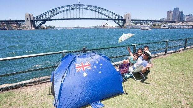 Front row seat: Jose Palacios and his family wait for the fireworks at McMahons Point.