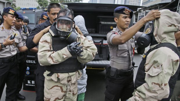 Members of the police bomb squad don protective gear prior to examining the site where an explosion went off in Jakarta on Thursday.