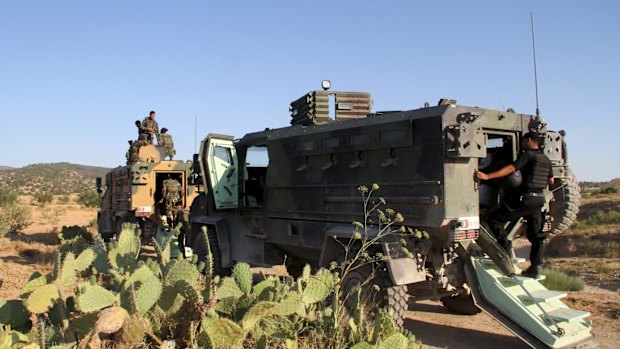 Tunisian soldiers and police patrol the area of Mount Salloum near Algeria's border earlier this month. 