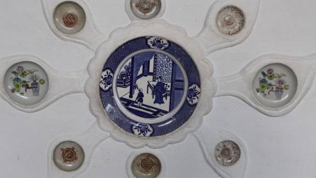 Crockery in the Chinese style embedded in the walls of the shrine. While this form of decoration has a long history in Indonesia, orthodox Islam holds a strong taboo against representation of living things in art, especially in a sacred precinct.