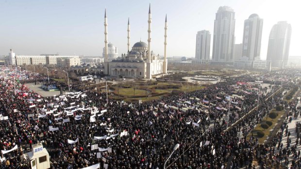 Mass protest: People attend a rally in Grozny, Chechnya, to protest against satirical cartoons of prophet Muhammad.