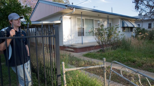 Lucas Shirdon looks at the overgrown garden in his neighbouring home in South Tamworth, one of many properties rented by Frank Lin.