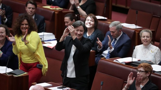 Labor's Penny Wong claps after the same-sex marriage bill passed the Senate on Wednesday.