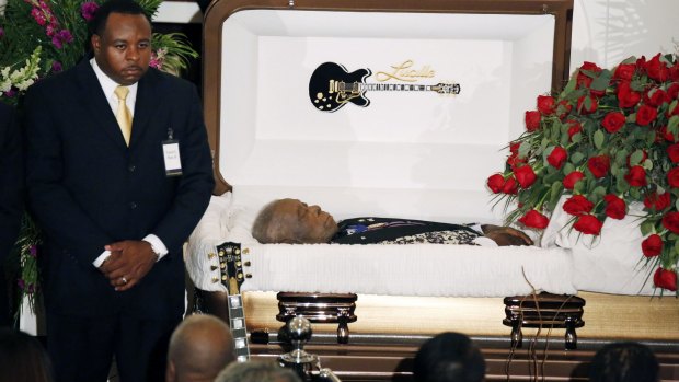 A funeral home attendant stands watch over the casket bearing blues legend BB King prior to his funeral mass at Bell Grove Missionary Baptist Church in Indianola.