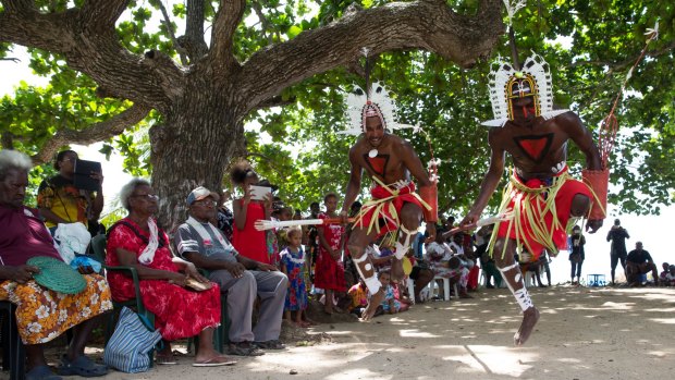 Locals watch the Neguams Dance Troup perform for the Recognise team on Mer Island in the Torres Strait. The team has spent two weeks traveling between islands promoting the campaign to gain recognition for Aboriginal and Torres Strait Islanders in the Australian Constitution. 