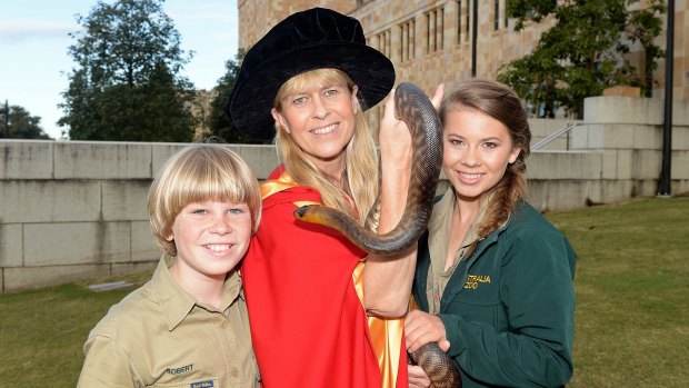 Terri Irwin with son Robert and daughter Bindi after receiving her honorary degree from the University of Queensland.