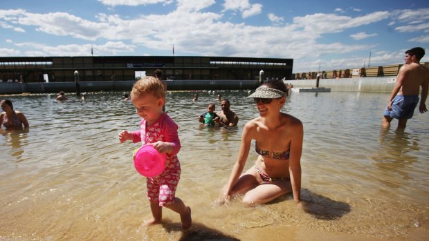 Laura Barnes and daughter Isabelle, 15 months, cool off at Dawn Fraser Baths.
