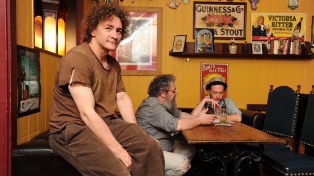 Phoenix bar manager Sean Hannigan and Owner Kieron Clohessy with poet in residence Adam Hadley in 2011.