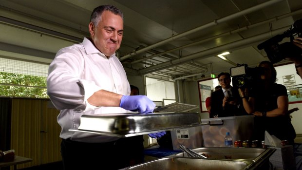 Joe Hockey manning the sausage sizzle at Bunnings in Chatswood.