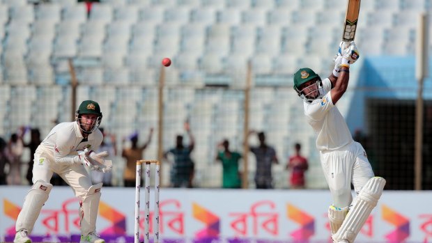 Bangladesh's Sabbir Rahman, right, plays a shot as wicketkeeper Matthew Wade follows the ball.