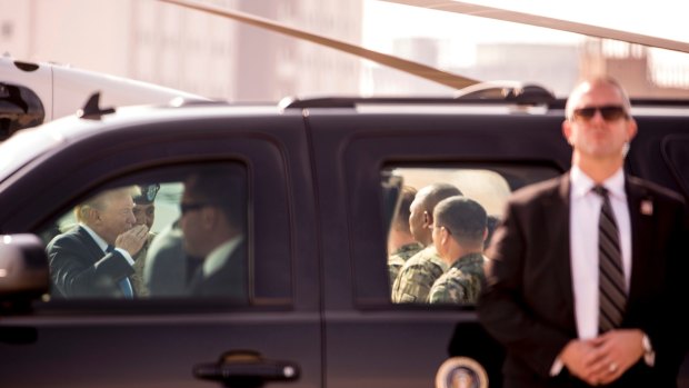 Donald Trump, left, greets members of the military as he arrives at Camp Humphreys in Pyeongtaek, South Korea.