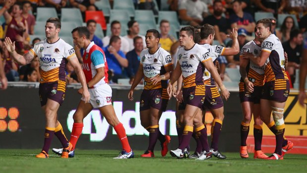 Impressive win: Anthony Milford celebrates with his teammates after scoring a try during the round one NRL match between the Parramatta Eels and the Brisbane Broncos at Pirtek Stadium.