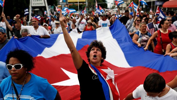 People celebrate the death of Fidel Castro in the Little Havana neighbourhood of Miami.